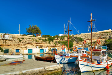 Beautiful view of Greek fishing boats anchored in small village