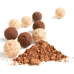 Delicious dark, milk, and white chocolate pralines on the white background