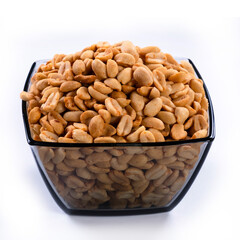 pile of spiced peanuts isolated close up on white background 