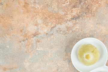 Tasty pickled fruit on white plate