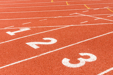 Start or finish position on running line track rubber lanes in the sport stadium.