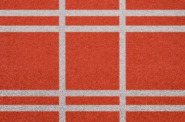 Top view of the running track rubber lanes cover texture with white line marking for background.