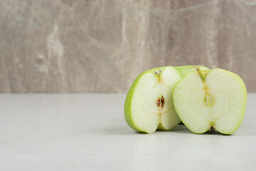 Half cut fresh apples on marble background