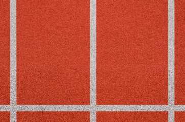 Top view of the running track rubber lanes cover texture with white line marking for background.