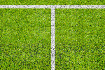 Top view of the white Line marking on the artificial green grass soccer field.