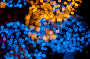 Abstract colorful soft blurred bokeh on black background. Shining and blurred circles lights bokeh background. For used wallpaper texture and background.