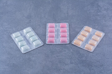 Gum packs with various flavors displayed on marble background