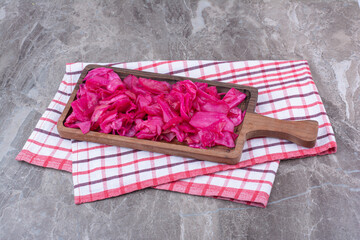 Pickled red cabbage on wooden board
