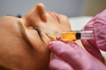 Blood plasma injections in the eye area.