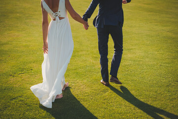 Obraz premium bride and groom walking