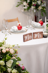 Beautiful wedding decoration. Banquet table setting and decoration. Flower decoration of wedding tables. Cutlery on the table.