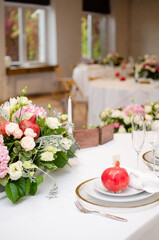 Beautiful wedding decoration. Banquet table setting and decoration. Flower decoration of wedding tables. Cutlery on the table.