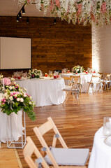 Beautiful wedding decoration. Banquet table setting and decoration. Flower decoration of wedding tables. Cutlery on the table.