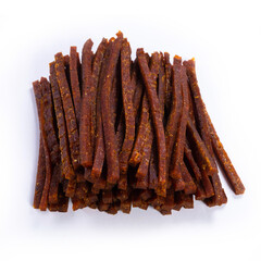 dried fish stick with pepper, snacks for beer isolated on white background