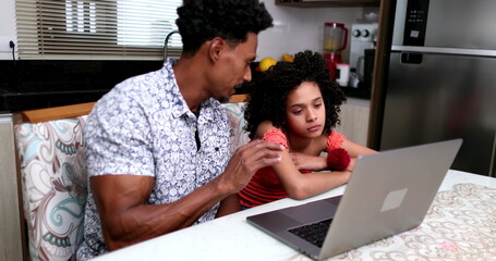 African father tutoring daughter girl in front of laptop computer2