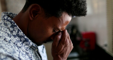 Anxious black man feeling emotional pain