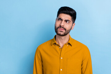 Photo of minded suspicious thoughtful intelligent person dressed yellow shirt look empty space...