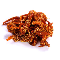 dried squid with sesame seeds and peppers on a white background
