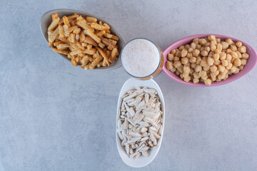 Three colorful plates with a glass of beer