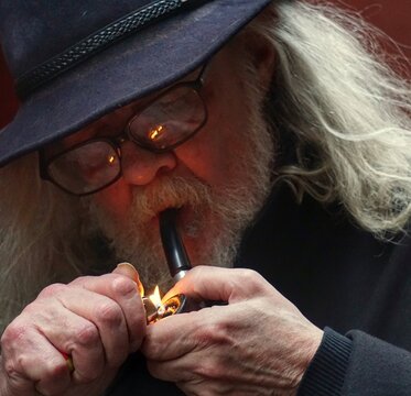 Close-up Of Old Man Smoking