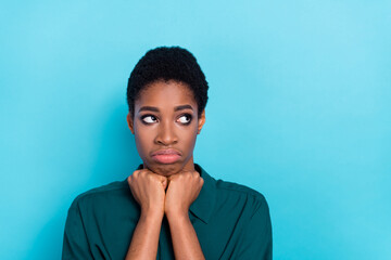 Portrait of attractive gloomy moody woman thinking copy space isolated over bright blue color background