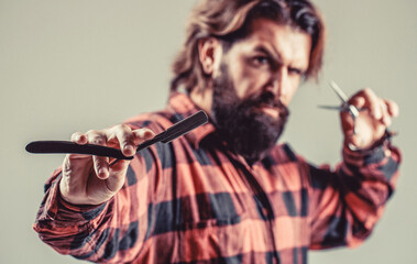 Portrait beard man. Barber scissors and straight razor, barber shop. Vintage barbershop, shaving