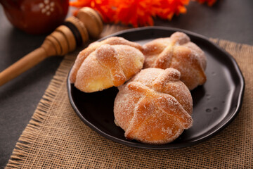 Pan de Muerto. Typical Mexican sweet bread that is consumed in the season of the day of the dead. It is a main element in the altars and offerings in the festivity of the day of the dead.