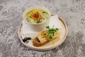 Pumpkin soup with herbs and sandwich