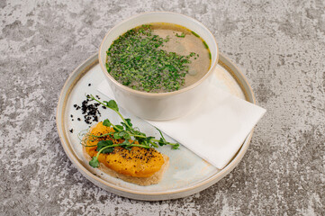 Mushroom soup with herbs and sandwich