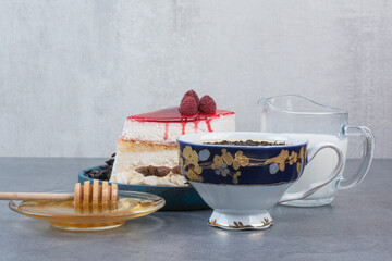 A piece of delicious cake with honey and milk