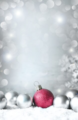 Christmas balls on snow silver background. Greeting card.