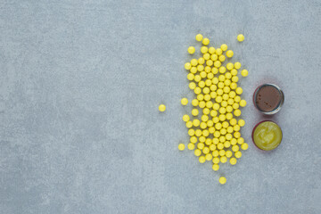 Ascorbic acid with ointment on gray background