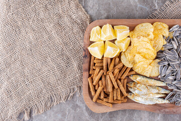Plate of various snacks on marble surface