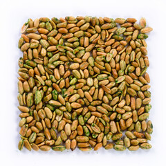 pile of salted peanuts with wasabi isolated close up on white background 