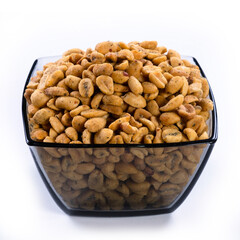 pile of spiced peanuts isolated close up on white background 