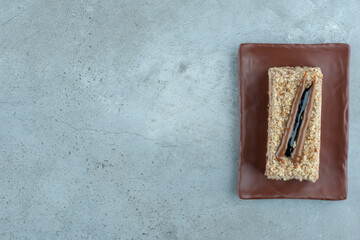 Slice of homemade cake on brown plate