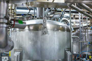 Stainless vertical steel tanks with pressure meter in equipment tank chemical cellar at the with scrolling wheel stainless steel tanks cleaning