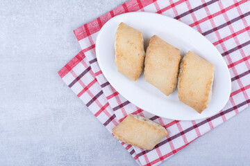 Cream filled biscuits on white plate