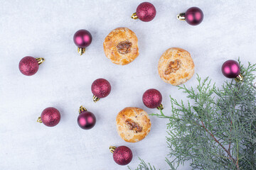 Cookies with walnuts and glittery Christmas balls