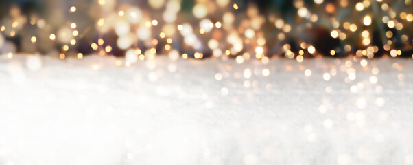 Christmas Winter background with bokeh lights on snow