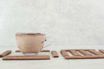 Aroma coffee and stick biscuits on marble surface