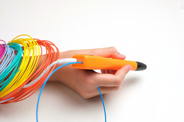 Teen Girl Using 3d Pen. Printing with Colored Plastic Wire Filament. Child making a House, drawing...