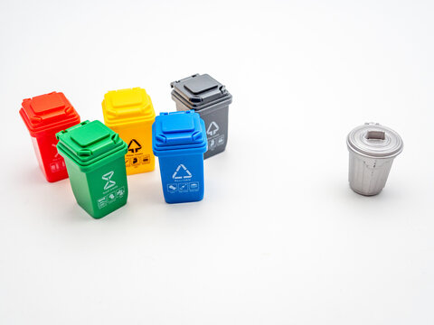 various colored recycle bins for different type of trash versus traditional trash bin on white, recycling environment protection concept