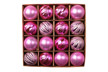 Pink glitter Christmas tree balls in cardboard craft box isolated on white background. Top view