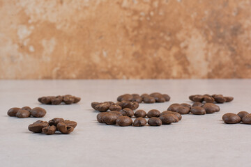 Roasted coffee beans on white background