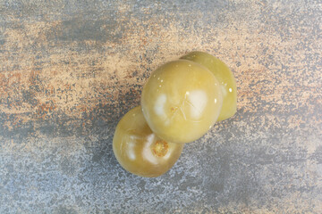 Some of salty delicious olives on marble background