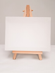 Close up of white empty easel for incriptions and pictures