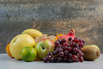 Bunch of various fruits on stone table
