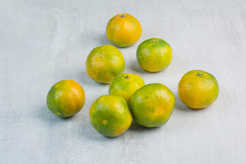 Bunch of fresh mandarines on stone background