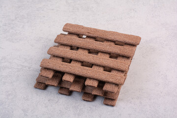 Bunch of stick biscuits on gray background